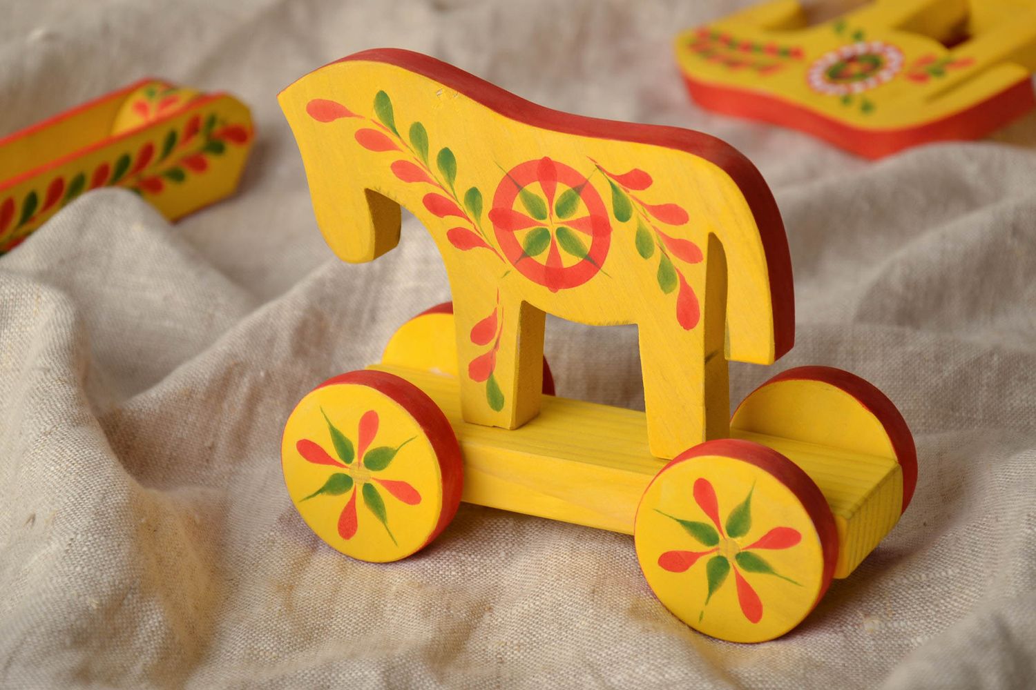 Wooden toy with wheels with ethnic painting Horse photo 1