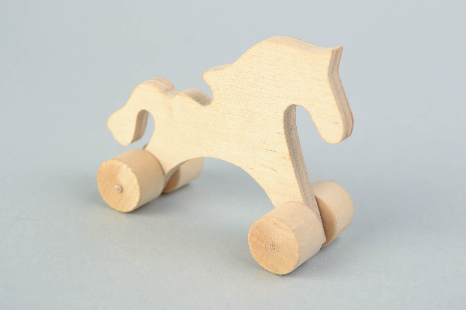 Material para manualidades juguete de madera hecho a mano caballo de ruedas foto 1