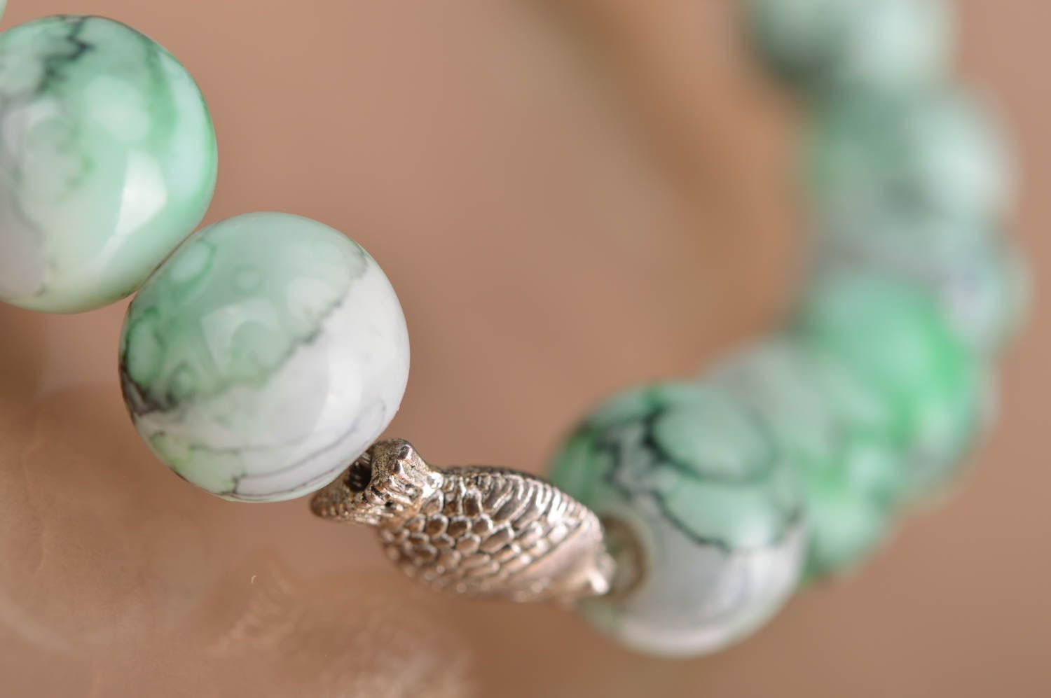 Handmade designer beaded green wrist bracelet with metal fish insert for women photo 4