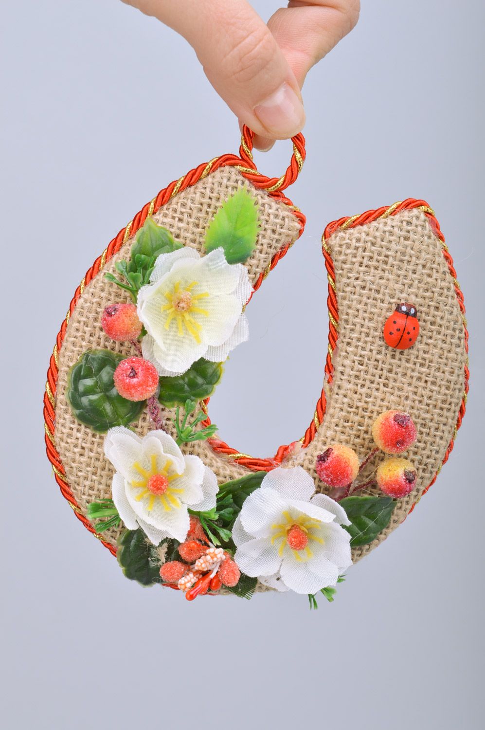Handmade horseshoe made of burlap with flowers and berries decor and with a loop photo 3