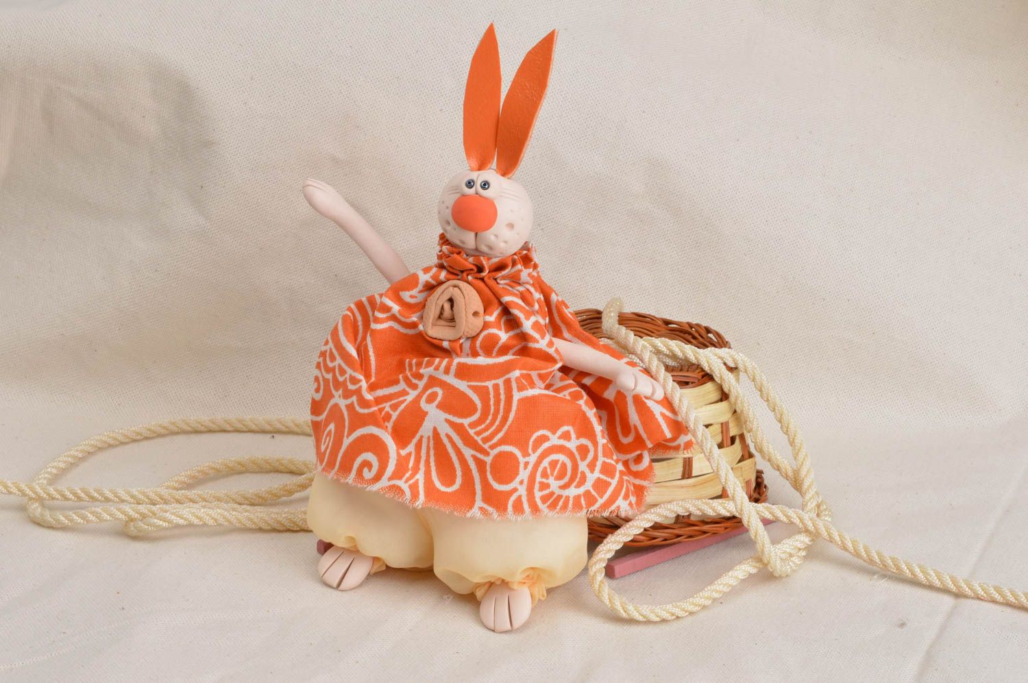 Handmade cute orange toy rabbit made of clay faience and cotton for decor photo 1