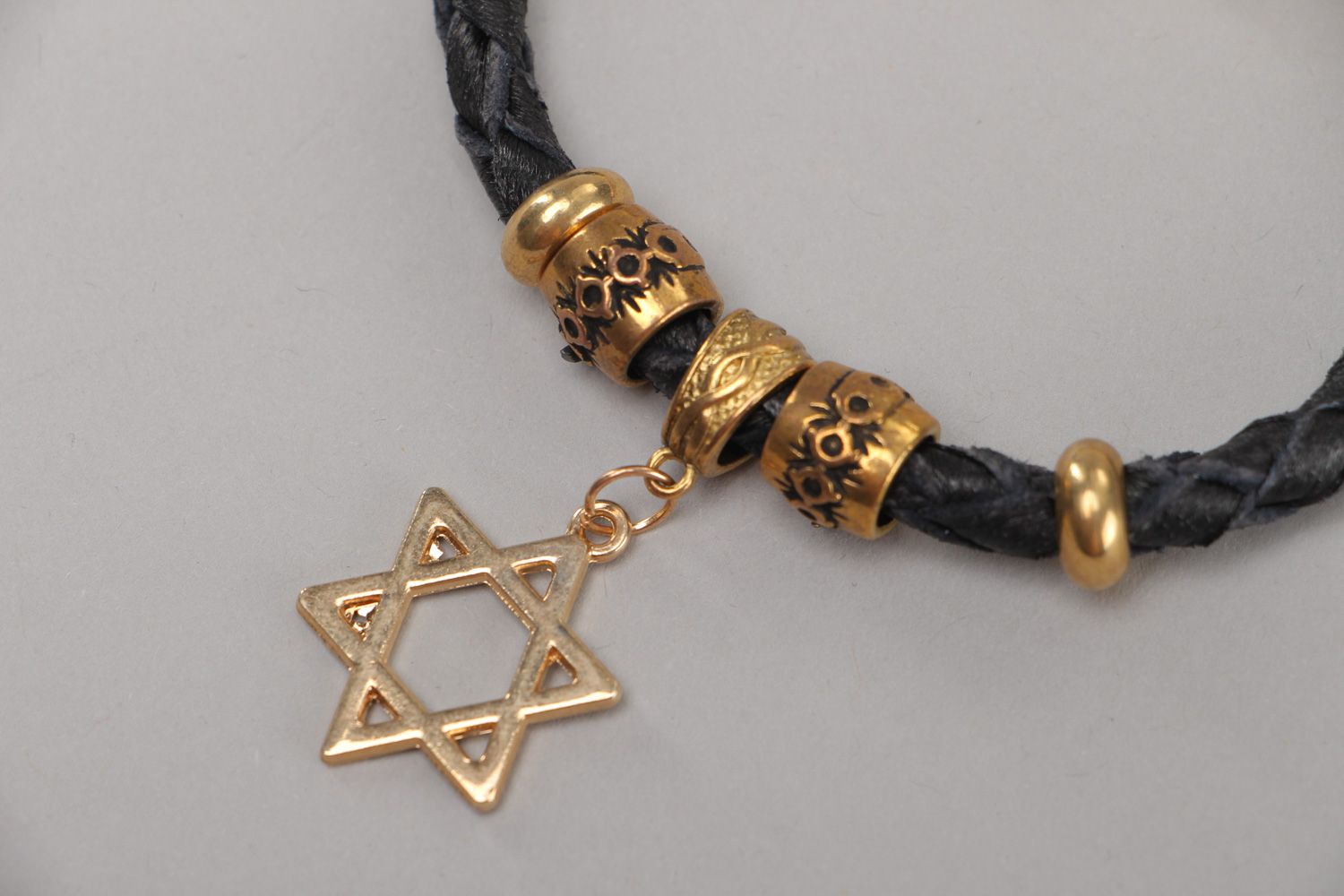 Handmade wrist bracelet woven of genuine leather with metal charm Star of Judah photo 3