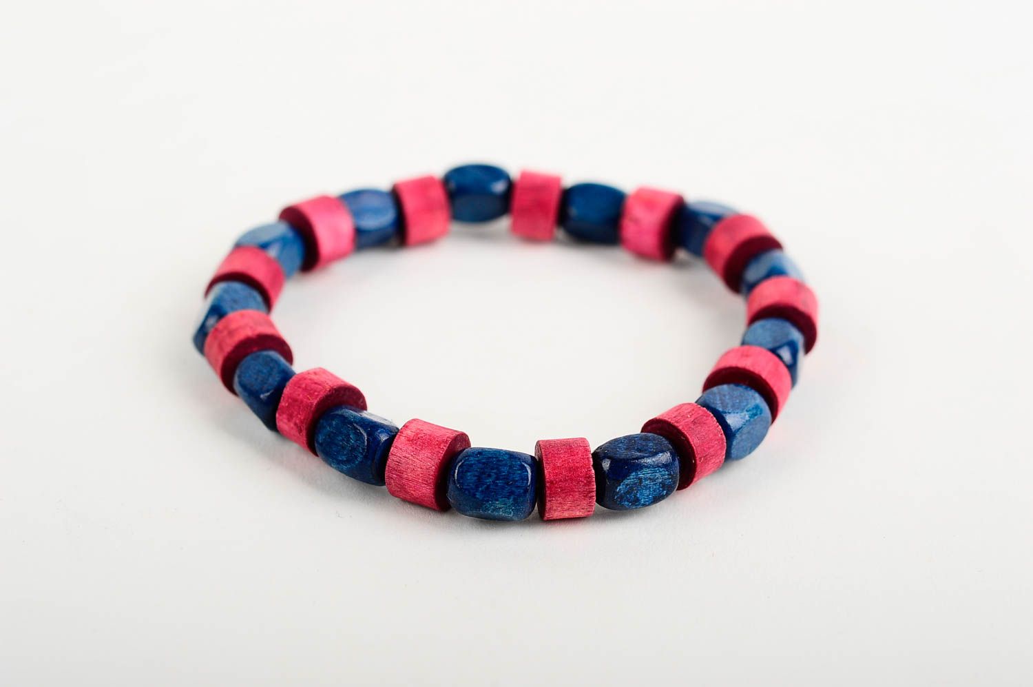 Stylish striped handmade beaded wooden bracelet wooden in red and blue color photo 3