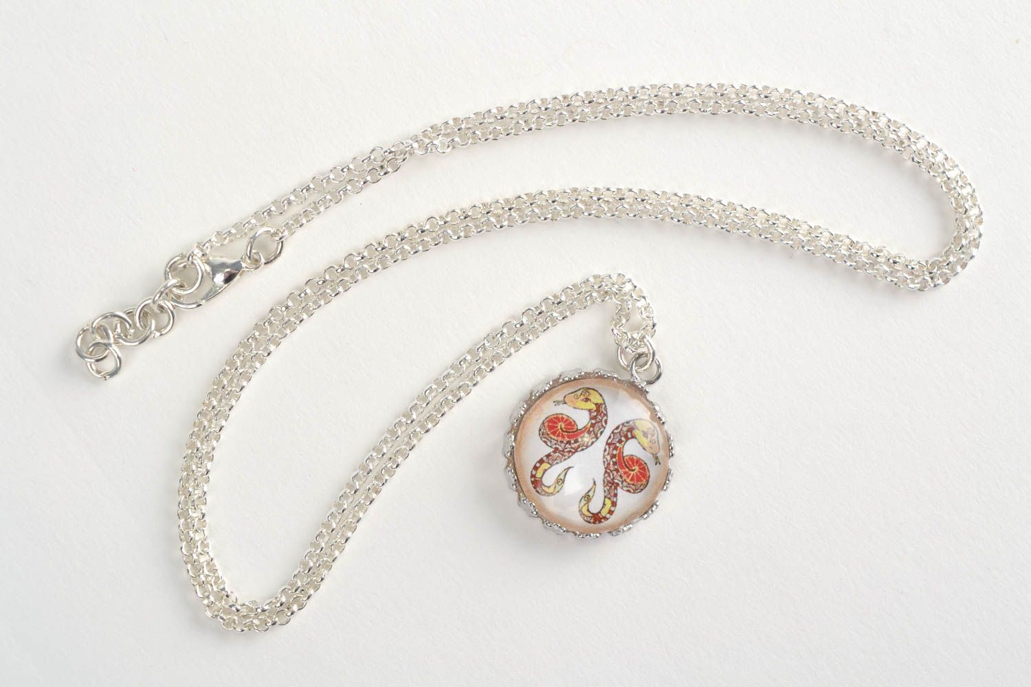 Handmade designer round white glass pendant with Gemini sign on metal chain  photo 1