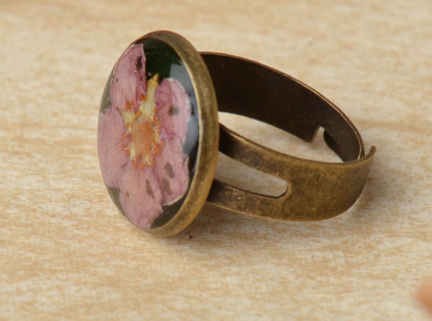 Handmade ring with natural flowers and epoxy resin photo 1