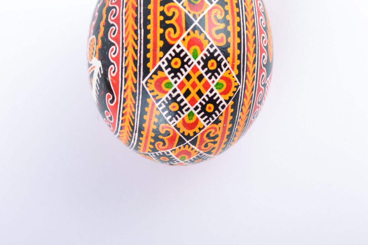Bright multi-colored handmade painted chicken egg with church image for Easter photo 4