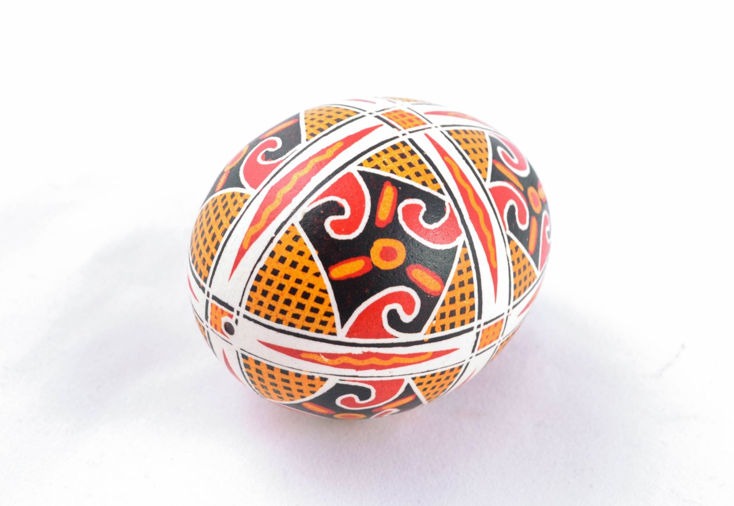 Handmade Easter egg painted with solar symbols photo 3