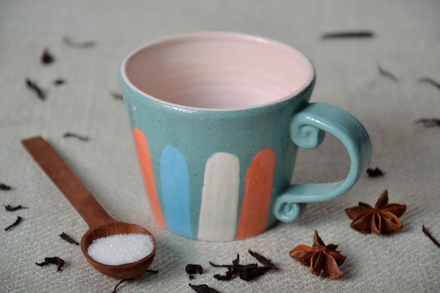 Porcelain cup with handle in blue, white, and orange color photo 1