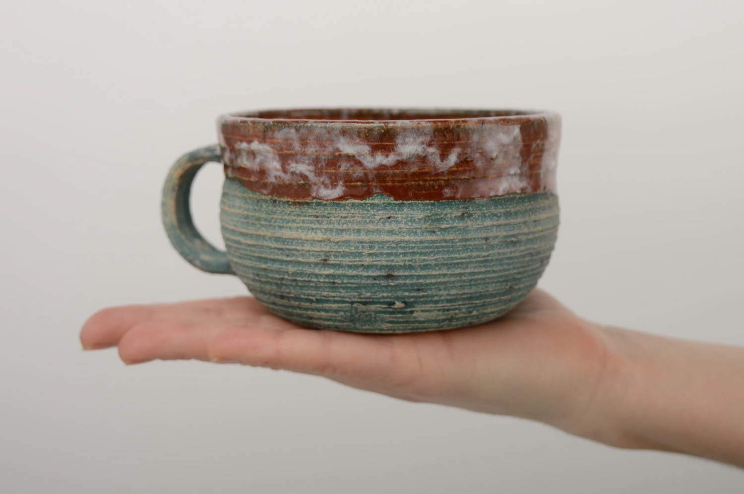 8 oz wide glazed handmade ceramic cup in blue and brown color with handle and no pattern photo 5