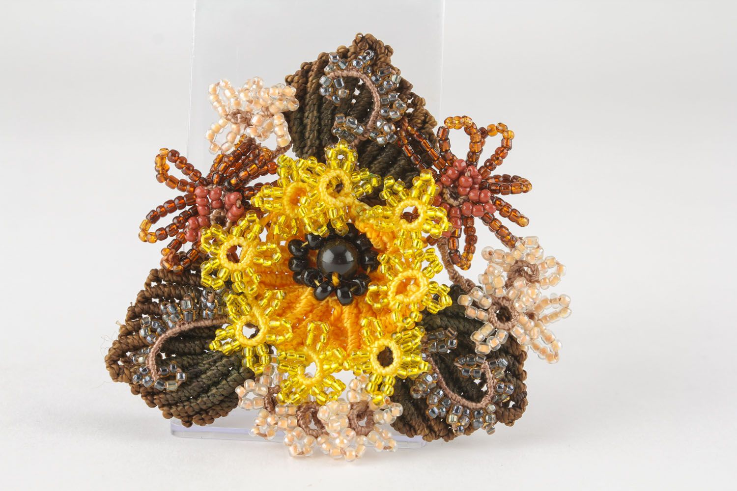 Beaded brooch made of threads photo 2