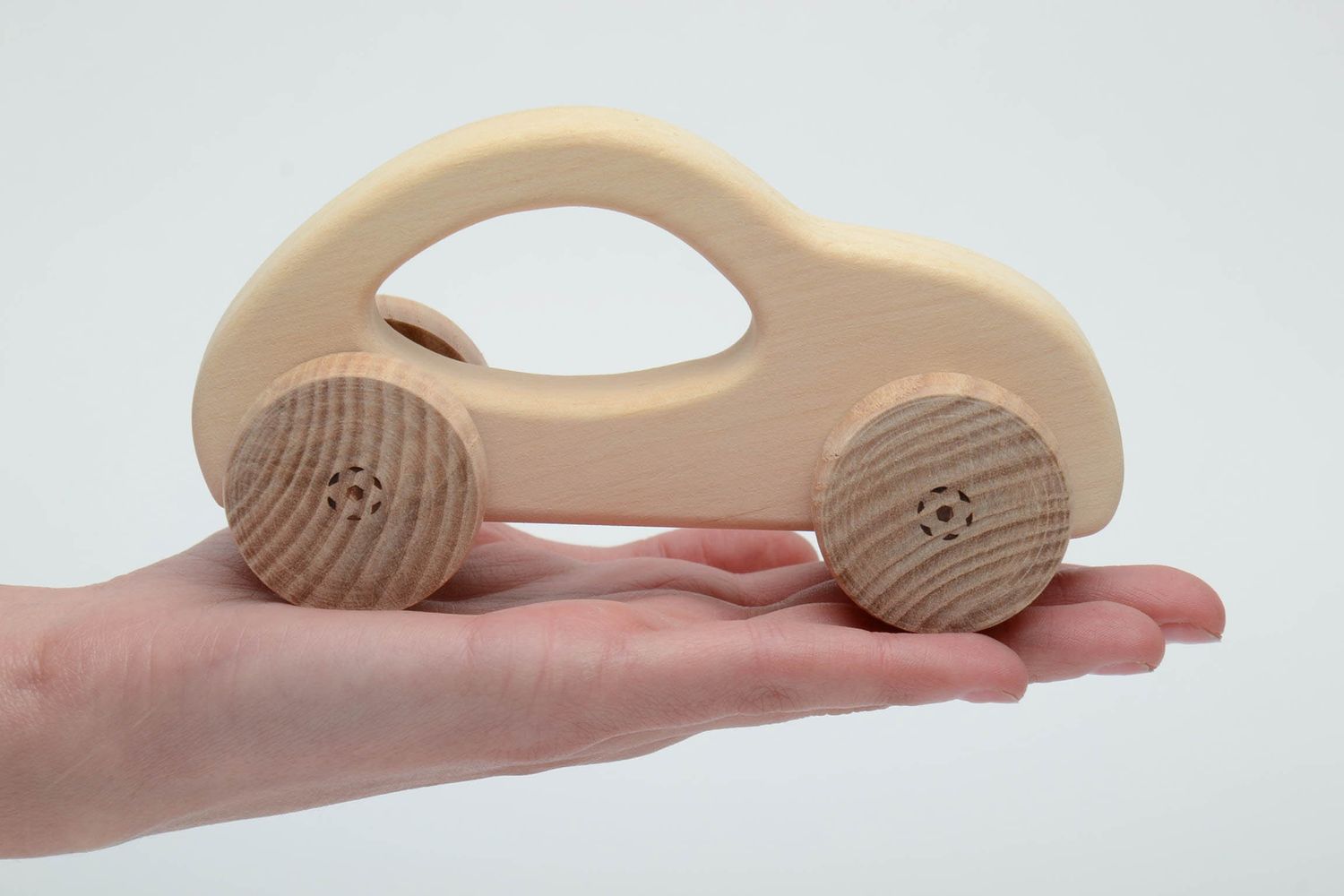 Wooden wheeled toy car photo 5