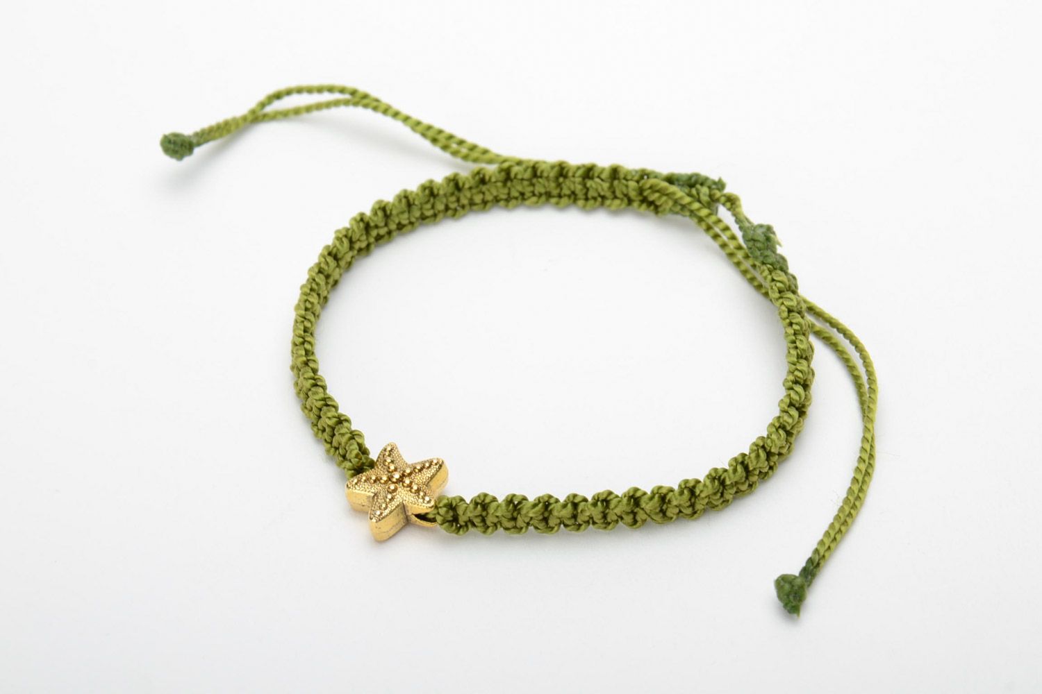 Handmade women's macrame woven bracelet of green color with charm in the shape of star photo 3