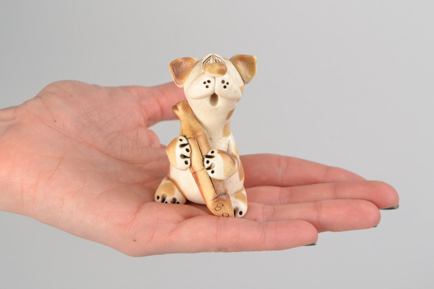 Handmade ceramic cat with sausage painted with colored glaze interior decor photo 2