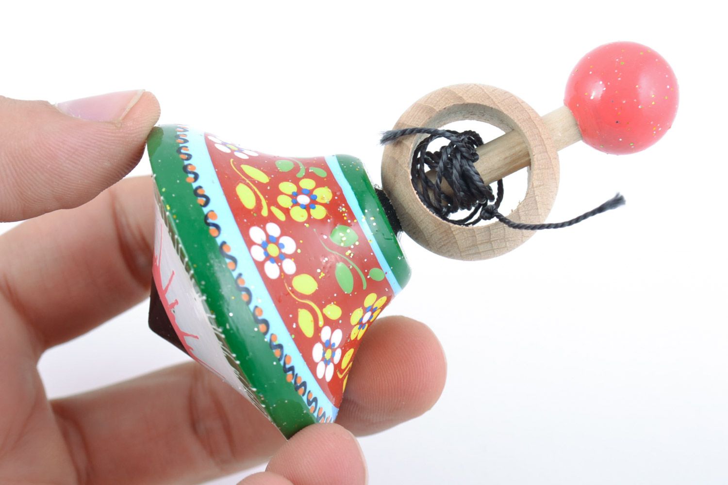 Small handmade decorative beautiful wooden spinning top with painted ornaments photo 2