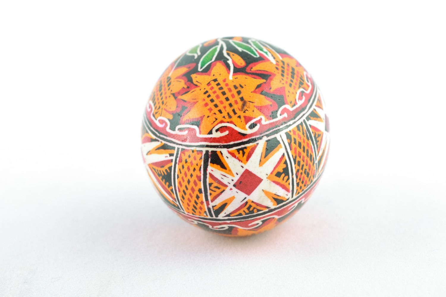 Handmade Easter egg with floral ornament on black background painted with hot wax photo 4