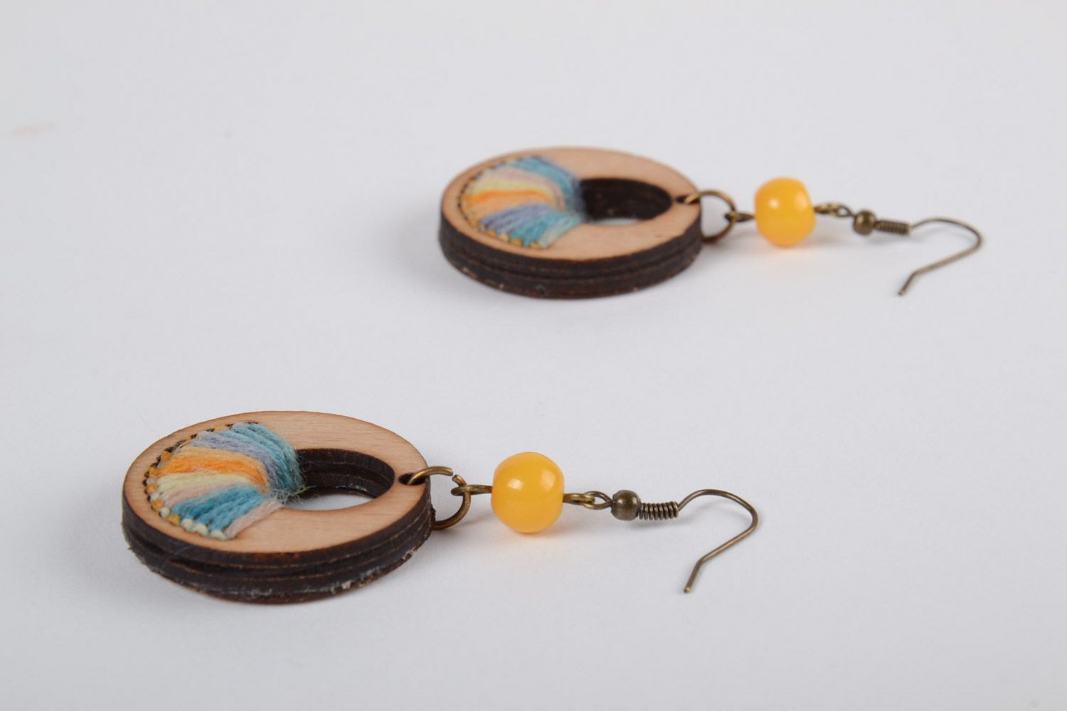 Handmade round plywood earrings with yellow and blue embroidery and beads photo 2