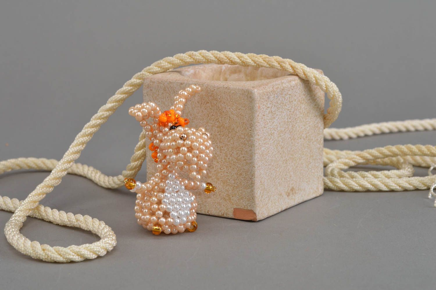 Small handmade woven bead statuette of beige donkey for home interior decor photo 1