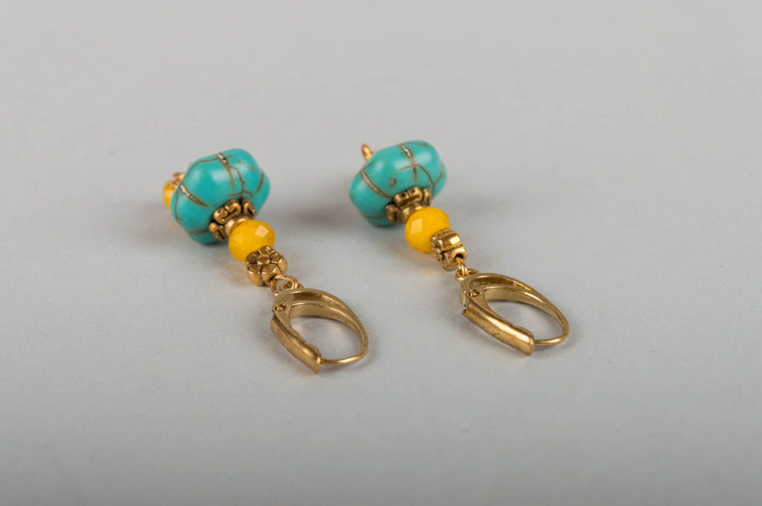 Beautiful handmade designer brass earrings with natural turquoise stone photo 3