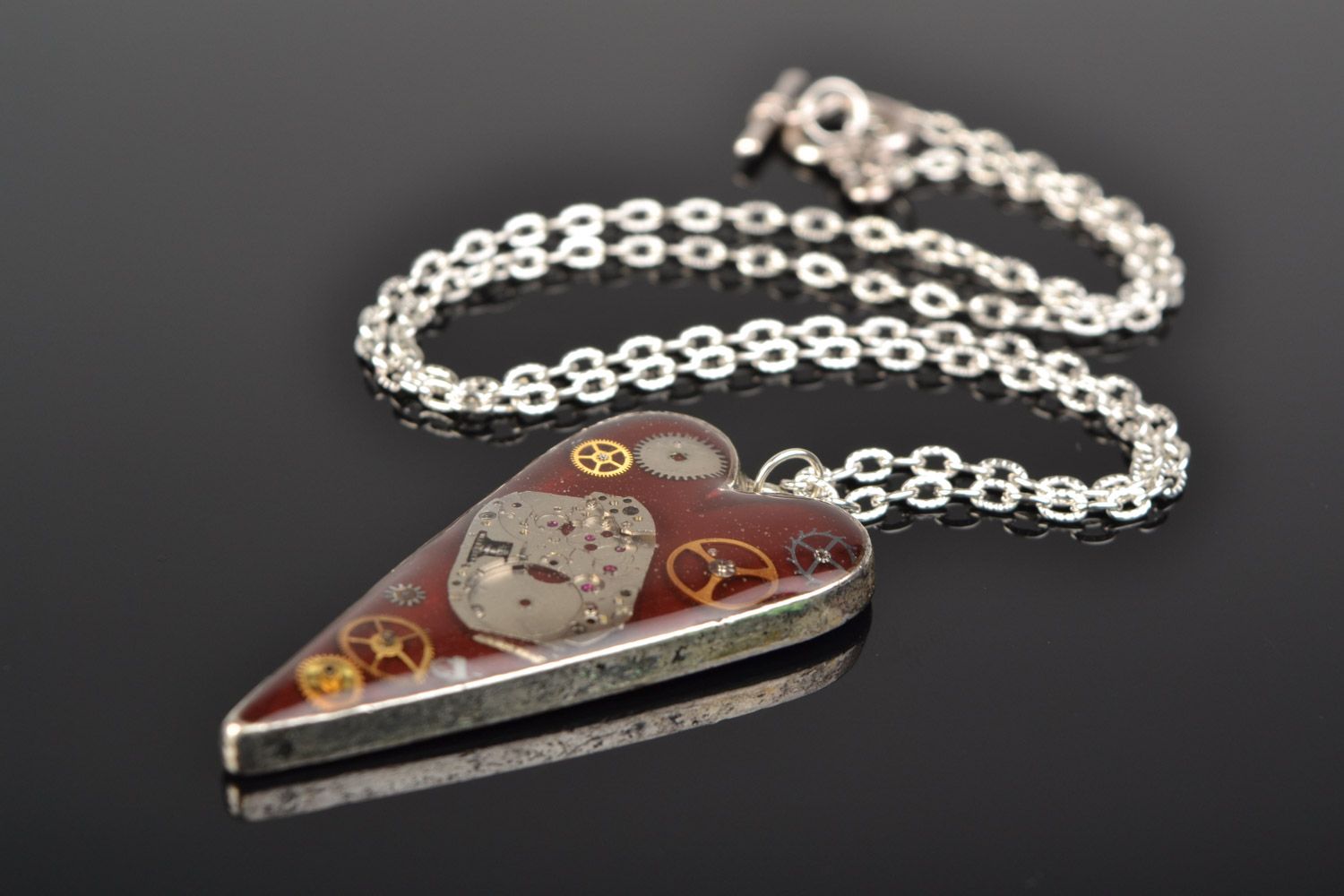 Handmade heart-shaped neck pendant in steampunk style with epoxy resin on chain photo 1