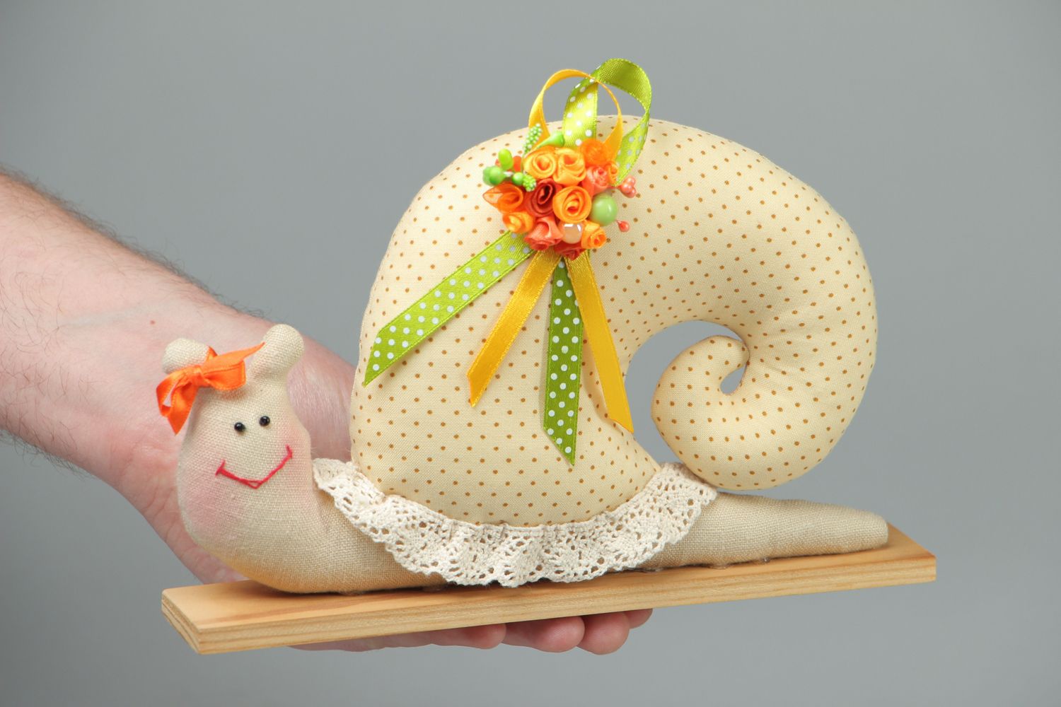 Textile toy snail on wooden holder photo 4