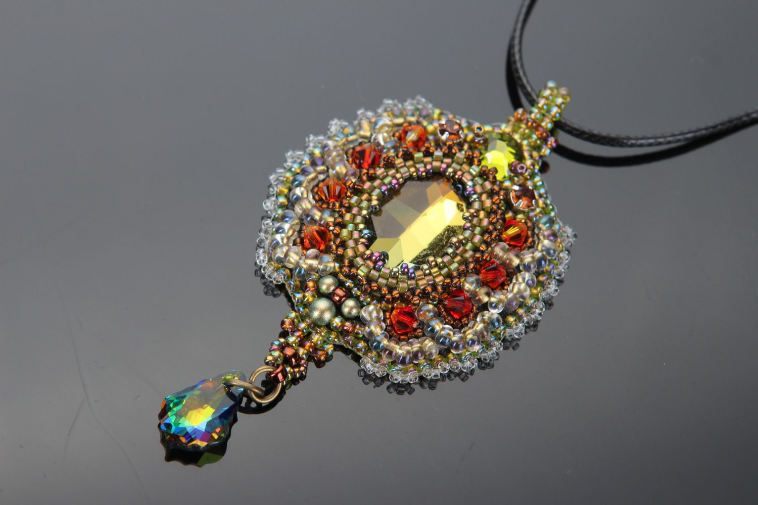 Handmade vintage golden-colored pendant embroidered with beads and crystals on cord photo 2