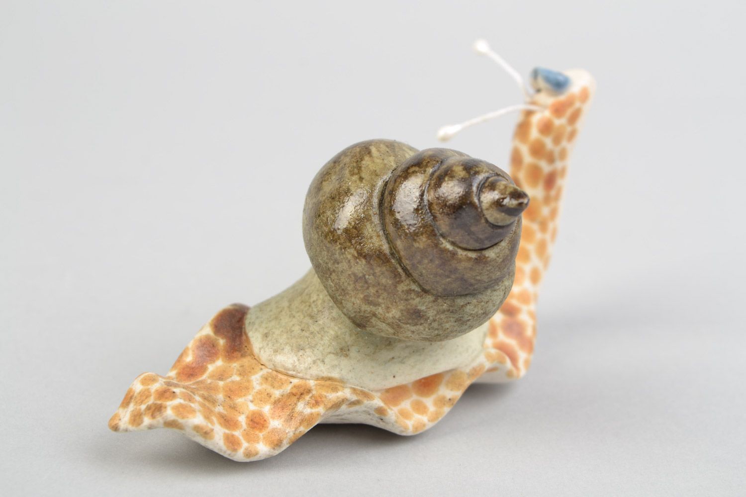 Handmade funny decorative ceramic figurine of smiling snail painted with glaze photo 5