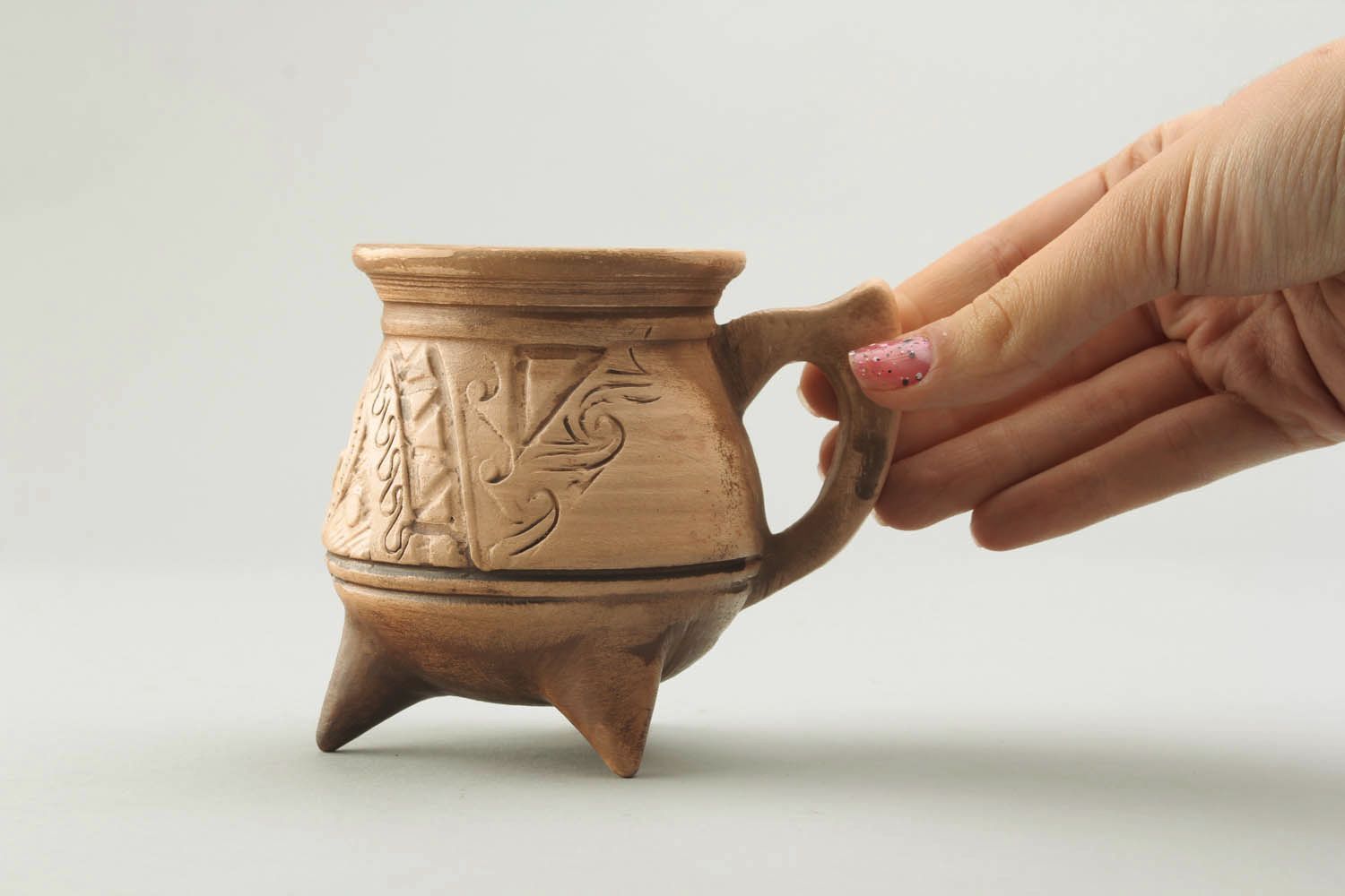 Medium size 6 oz clay not glazed coffee cup on tree legs with handle and pattern in Mayan style photo 2