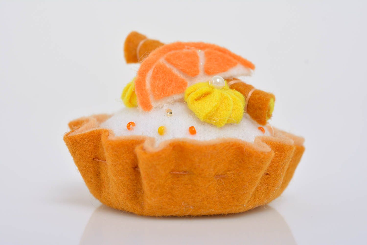 Handmade designer decorative soft pincushion sewn of felt bright orange cake photo 3