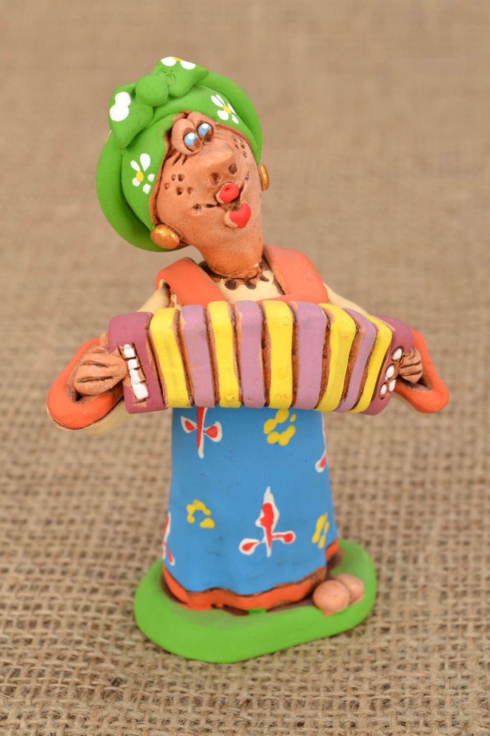 Bright clay figurine Cossack Woman Playing an Accordion photo 1