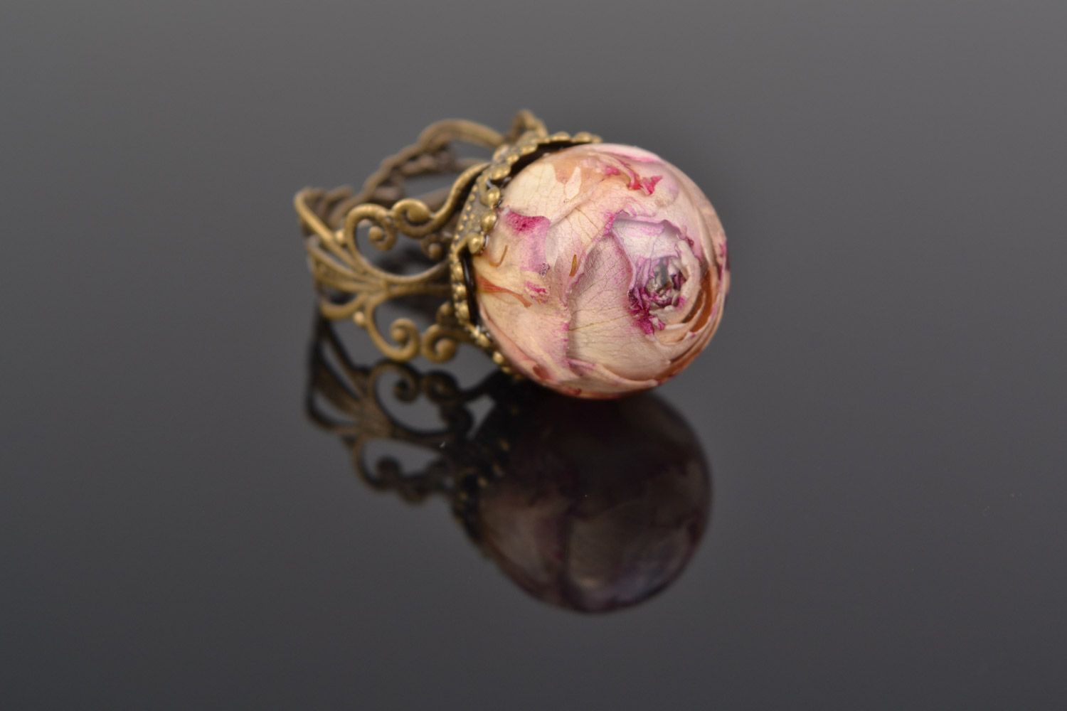Unusual handmade ring with real flower coated with epoxy resin photo 1