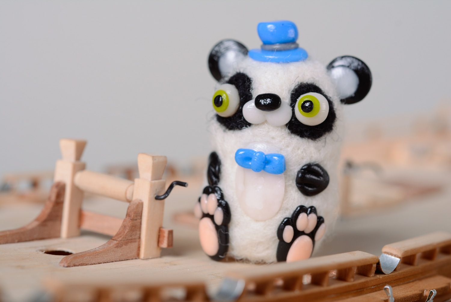Handmade miniature wool toy panda made using needle felting technique photo 1