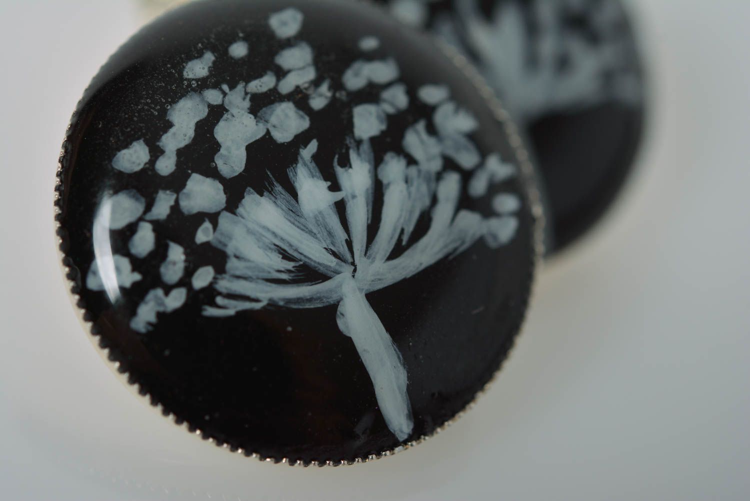 Round-shaped black handmade earrings made of epoxy resin with picture inside photo 4