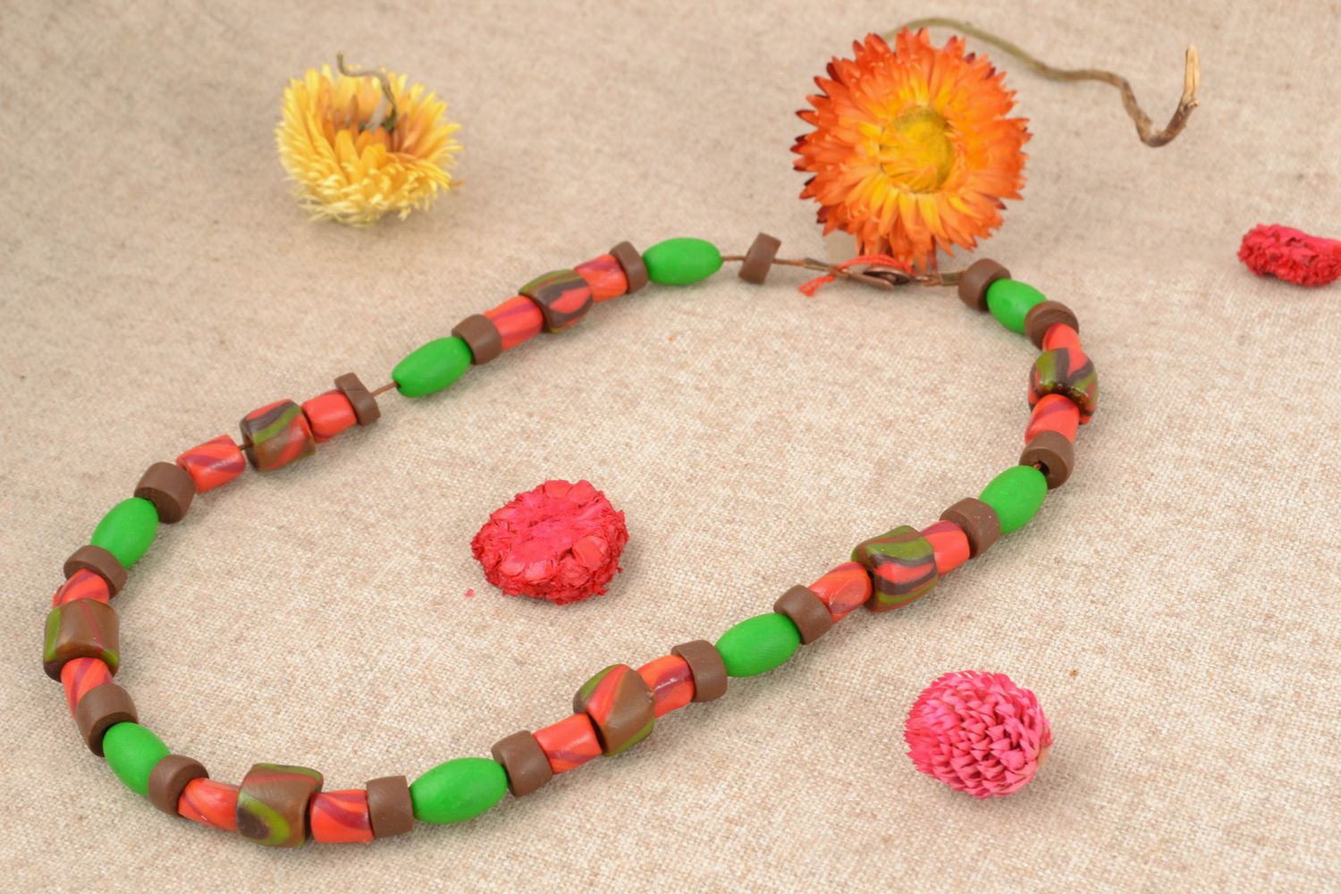 Clay beads necklace in light green, brown and red colors photo 1