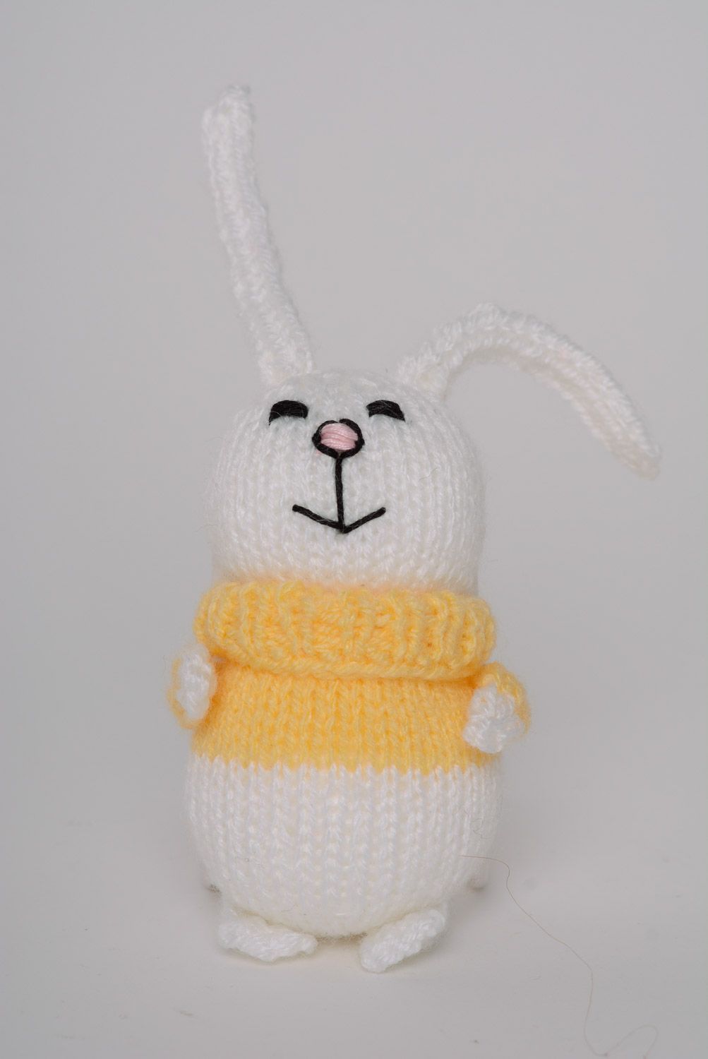 Small funny handmade knitted soft toy hare in sweater for children photo 1