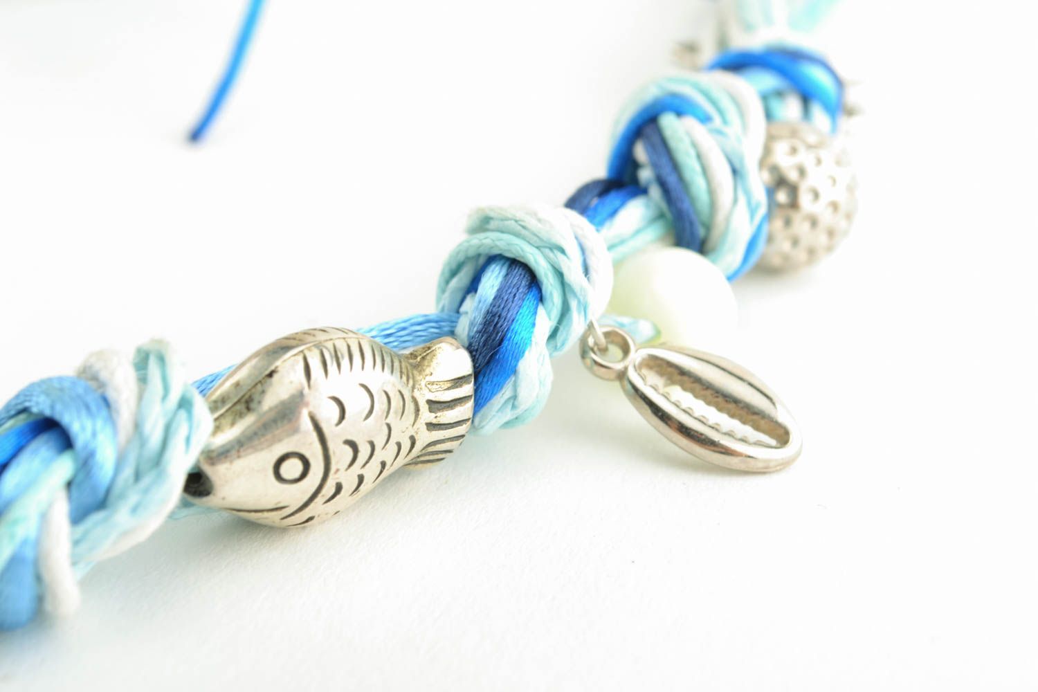 Textile necklace with metal charms photo 3