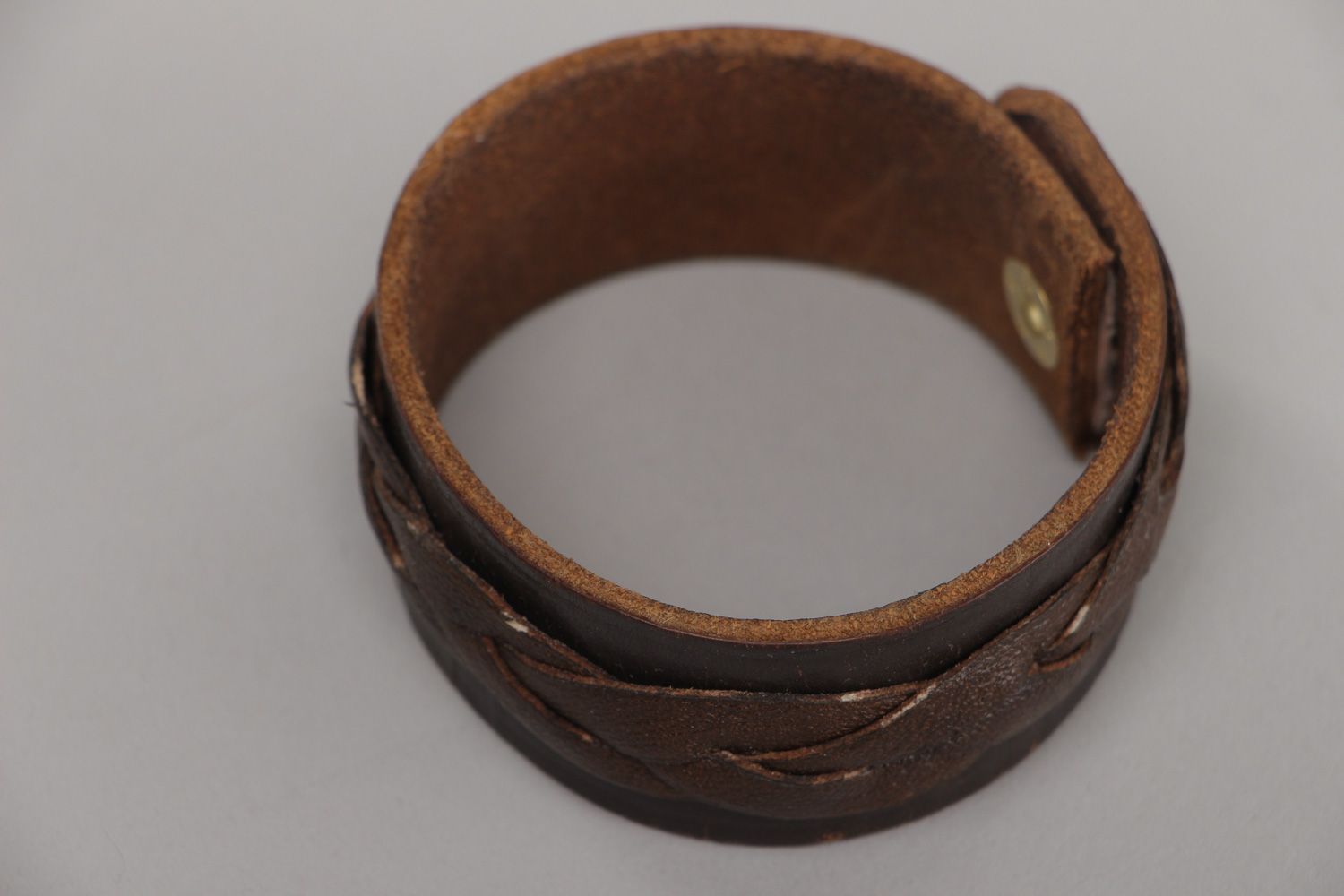 Handmade wrist bracelet woven of genuine brown leather with metal stud unisex photo 5
