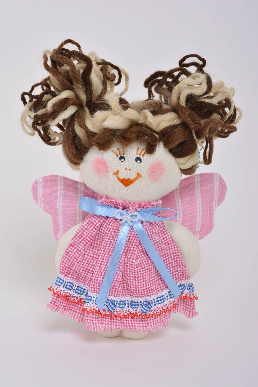 Beautiful small handmade fabric soft doll in pink dress for children photo 1