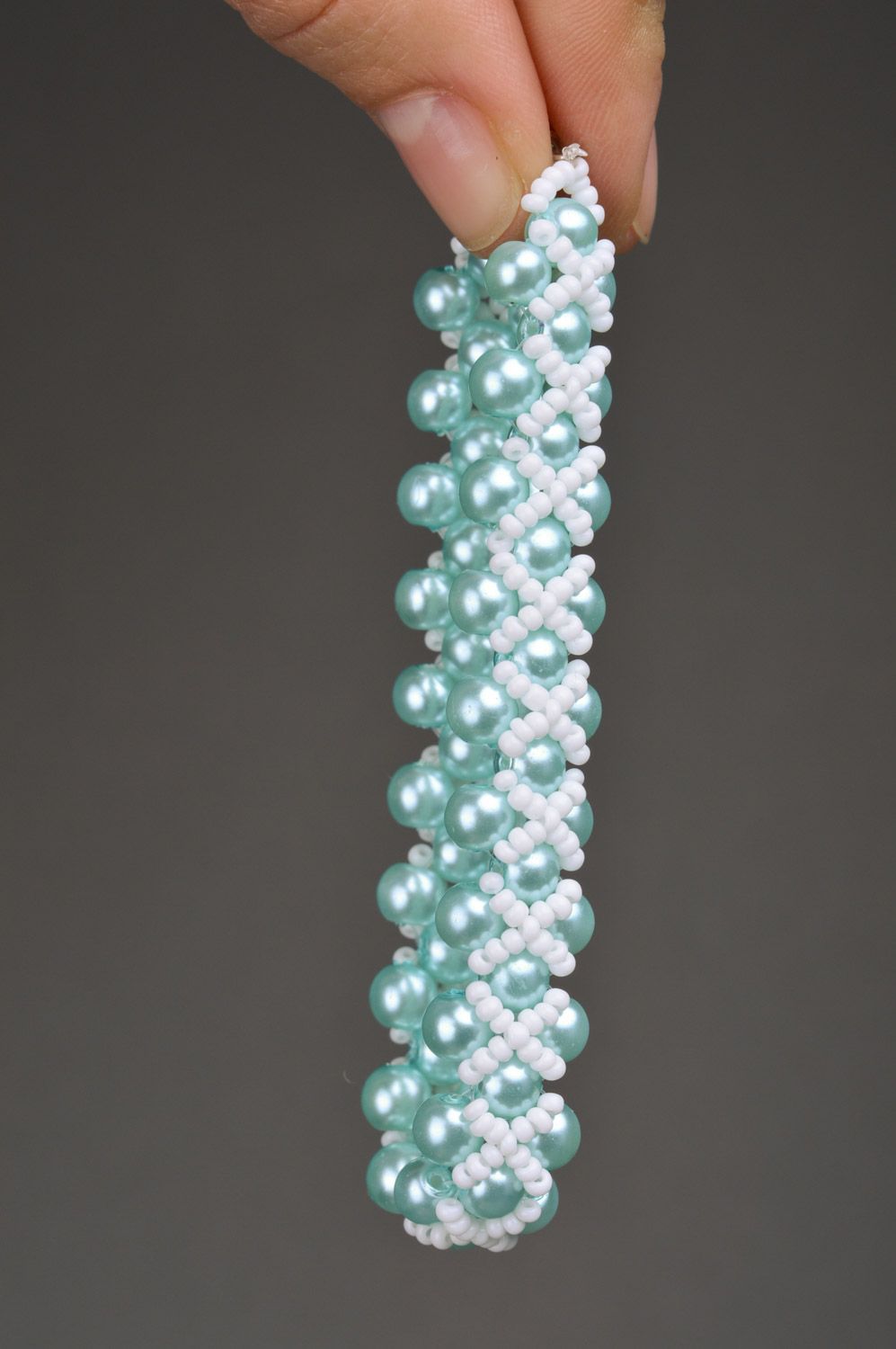 Beautiful handmade wrist bracelet woven of white and blue beads for girls photo 3