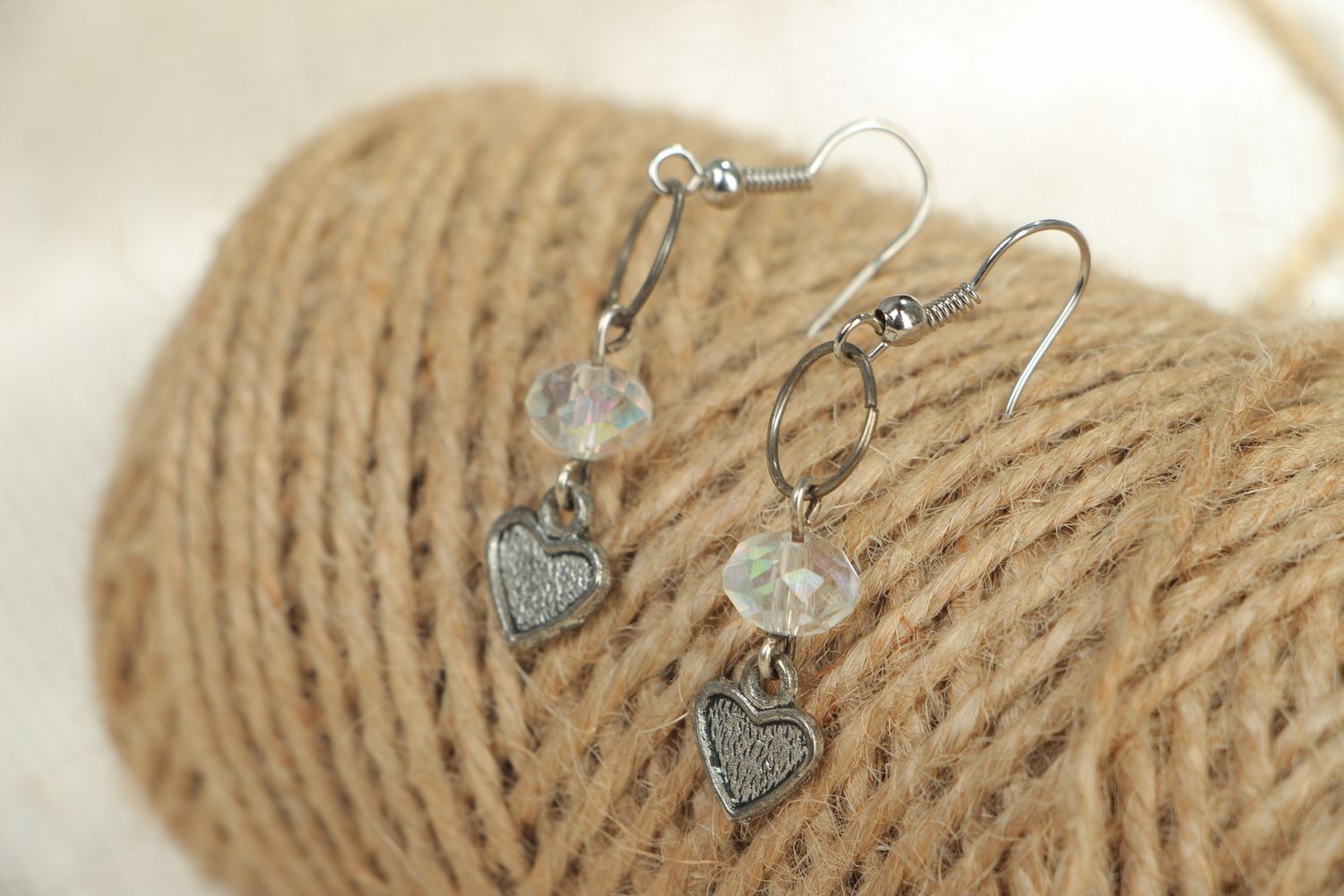 Metal earrings with heart beads photo 4