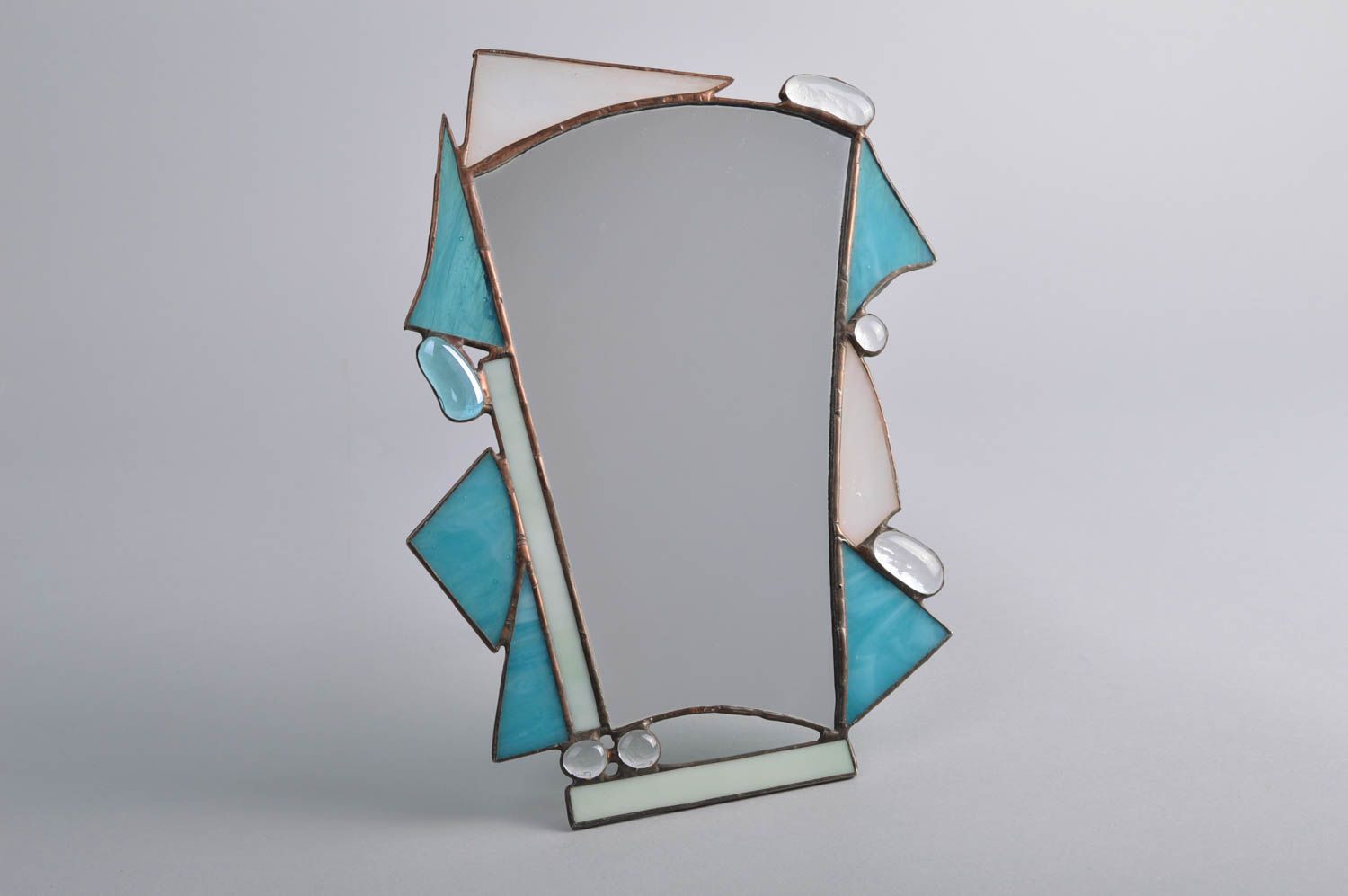 Handmade small table mirror of unusual shape in stained glass frame photo 2