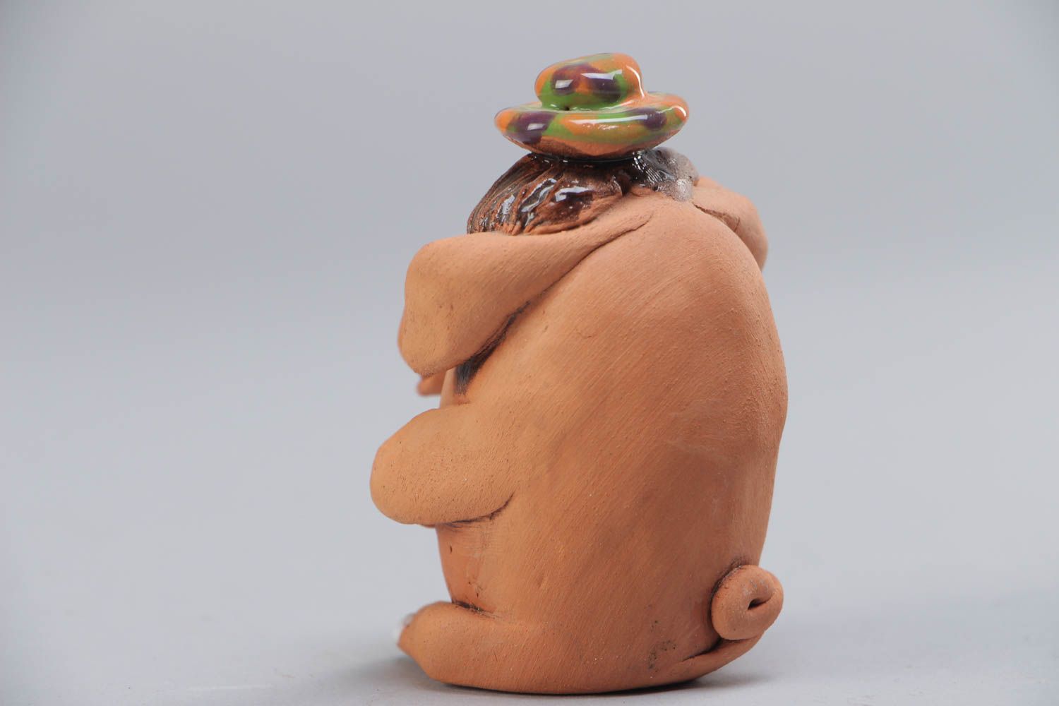 Small handmade ceramic figurine in the shape of funny pig for interior decoration photo 3