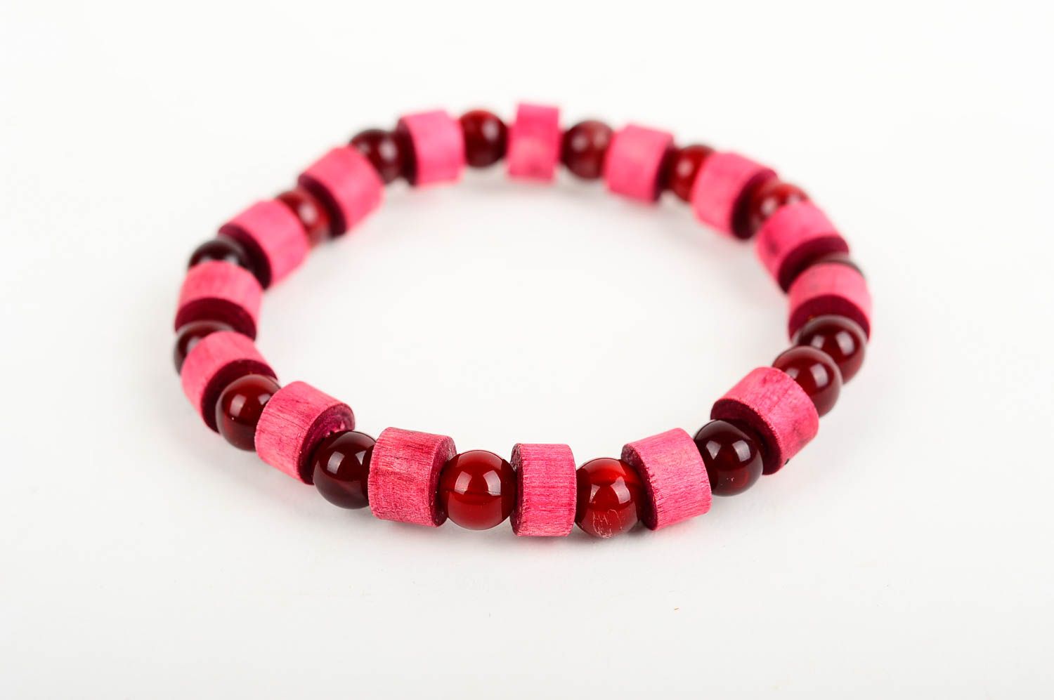 The wide wooden handmade beaded bracelet with dark red and light red beads on elastic cord photo 3