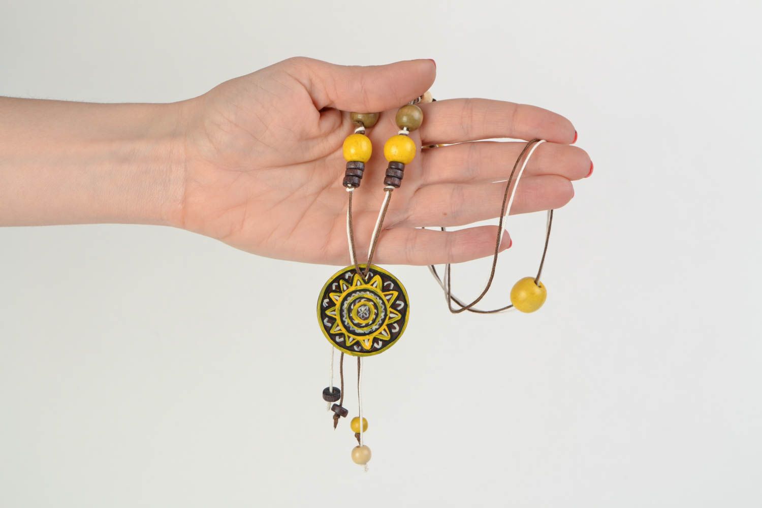Handmade ethnic yellow and black polymer clay neck pendant on a cord with beads  photo 2