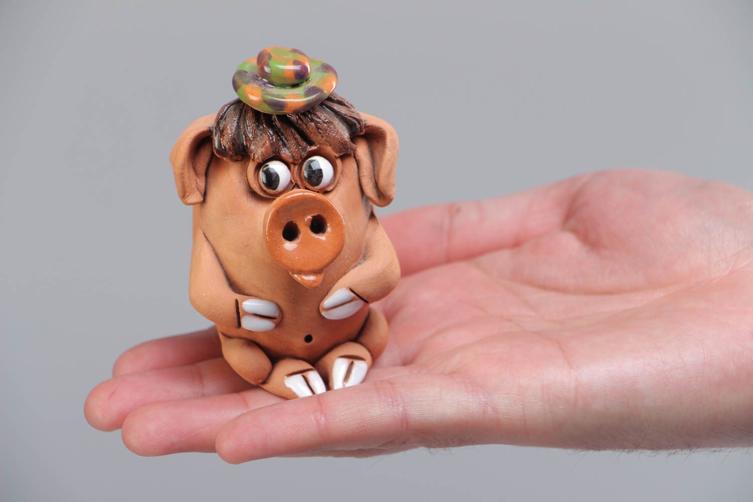 Small handmade ceramic figurine in the shape of funny pig for interior decoration photo 5