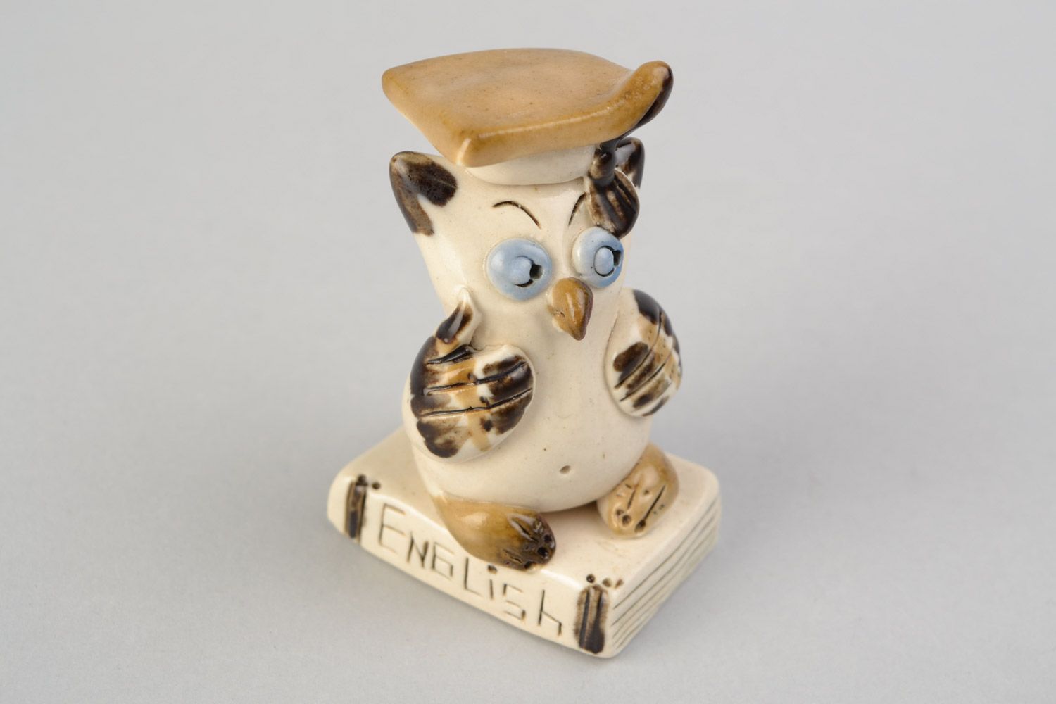 Handmade small cute ceramic figurine of owl in graduate cap painted with glaze photo 1