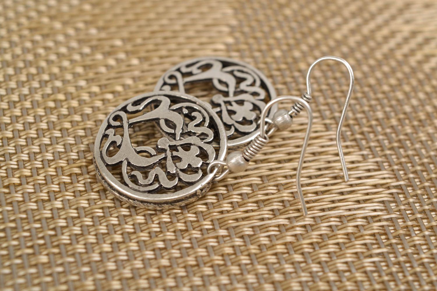 Round metal earrings with curls photo 1