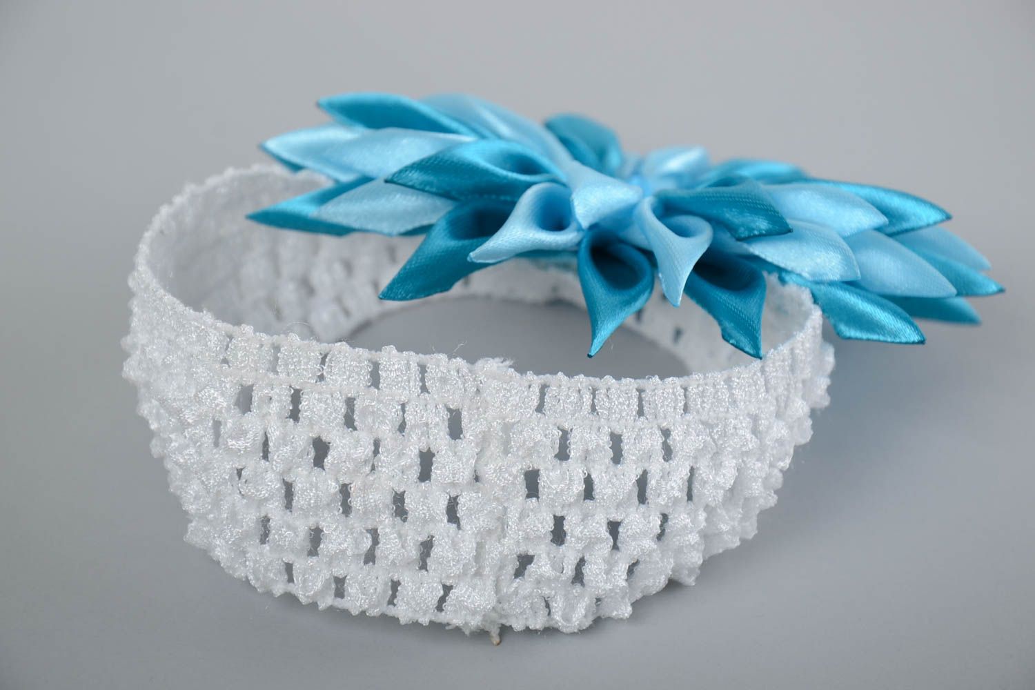 Children's white handmade elastic headband with blue satin flower photo 2
