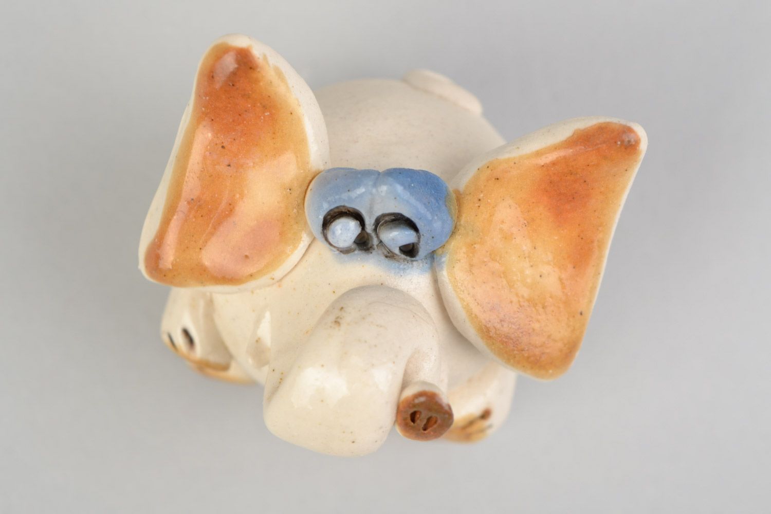 Handmade designer miniature ceramic figurine of funny elephant painted with glaze photo 1