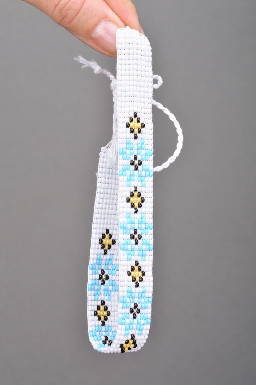 Beautiful women's handmade woven Czech bead necklace of white color with blue flowers photo 3