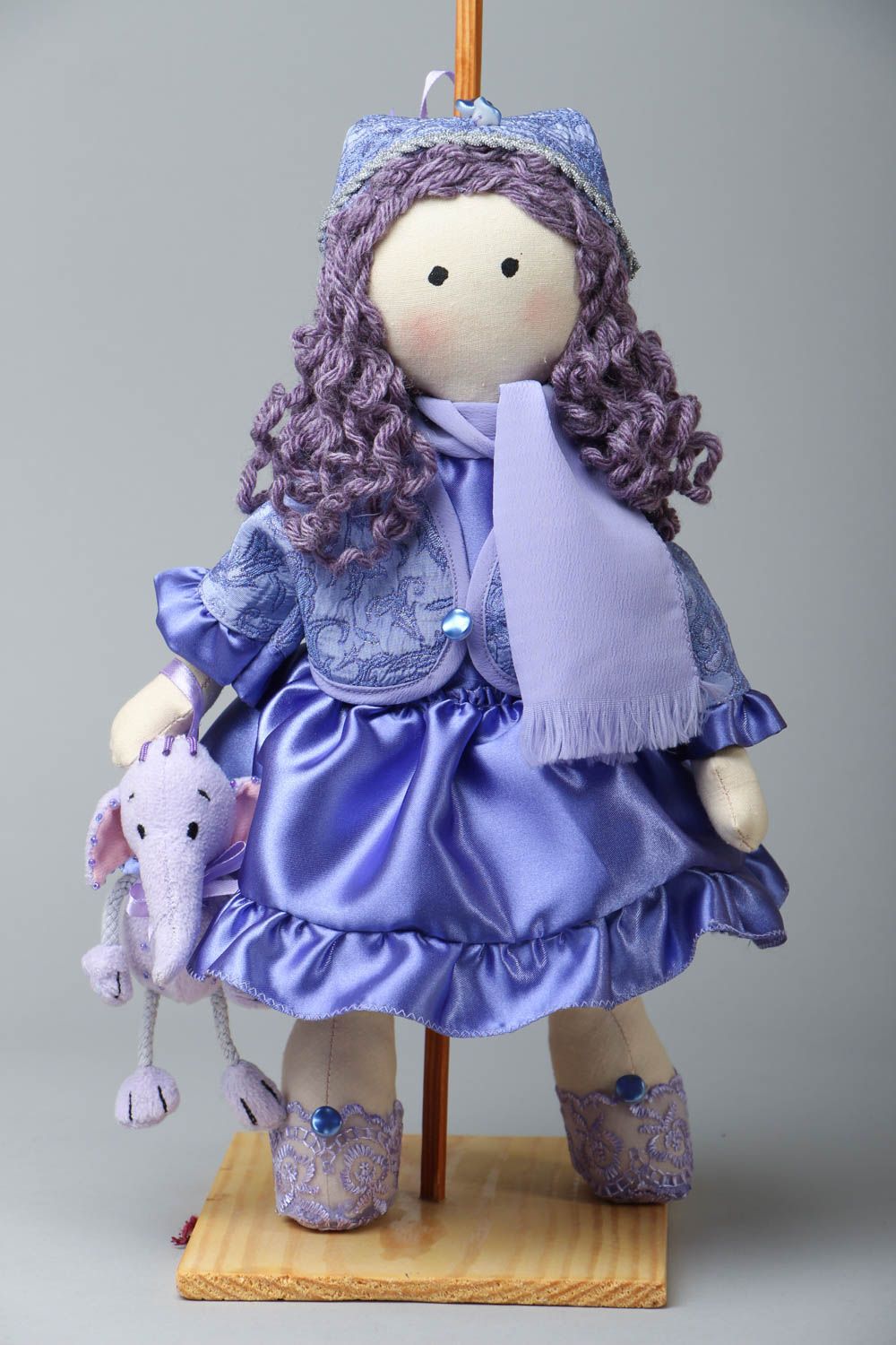 Fabric doll with a stand photo 1